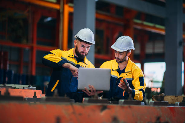 istock Engineers or foreman inspecting and check up machine at factory machines. Worker industry working in the metal sheet company. 1781247911