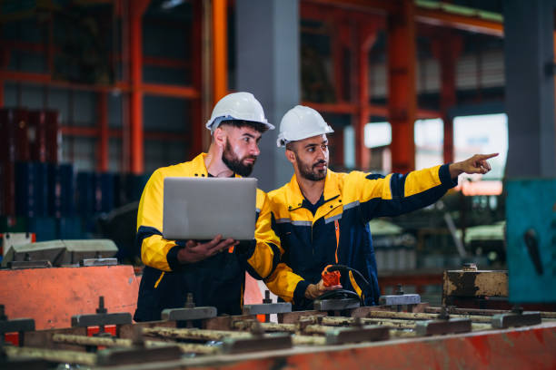 istock Engineers or foreman inspecting and check up machine at factory machines. Worker industry working in the metal sheet company. 1781248953