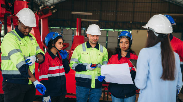 istock Engineers and foreman inspecting and meeting about the automated arms machine welding robots at factory machines. Worker industry working in the manufacture industrial. 1781260720