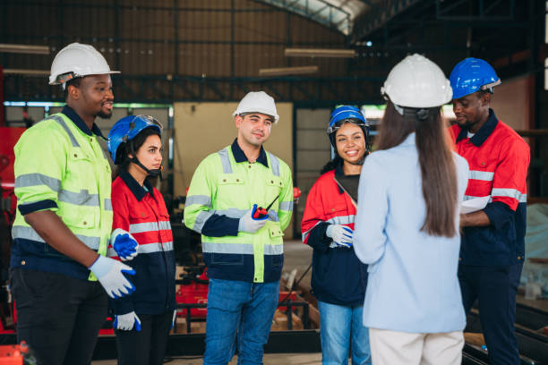 istock Engineers and foreman inspecting and meeting about the automated arms machine welding robots at factory machines. Worker industry working in the manufacture industrial. 1781261775