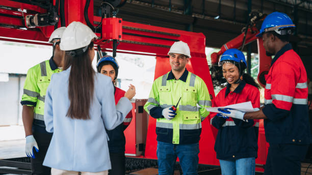 istock Engineers and foreman inspecting and meeting about the automated arms machine welding robots at factory machines. Worker industry working in the manufacture industrial. 1781261789