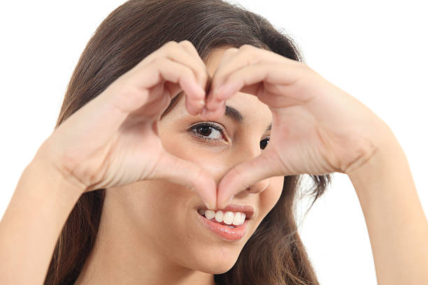istock Beautiful woman making a heart shape 178126416