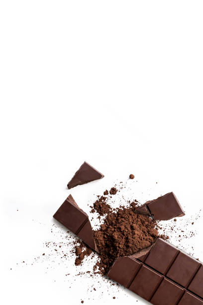 istock Broken organic dark chocolate bar and chocolate powder isolated on a white background from above, top view 1781264963