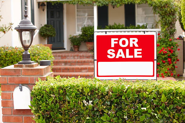 istock Pathway to a house that has a for sale sign 178126514