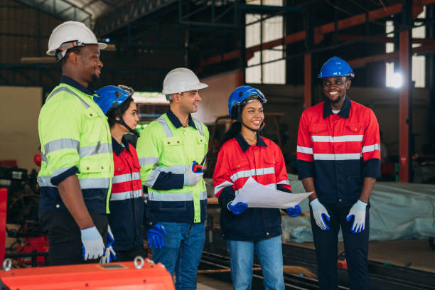 istock Engineers and foreman inspecting and meeting about the automated arms machine welding robots at factory machines. Worker industry working in the manufacture industrial. 1781266379