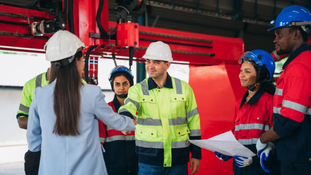 istock Team engineers and foreman stack hand and shake hands to show success at factory machines. Worker industry join hand for collaboration. 1781266750