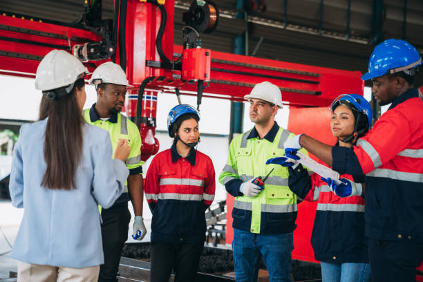 istock Engineers and foreman inspecting and meeting about the automated arms machine welding robots at factory machines. Worker industry working in the manufacture industrial. 1781268916