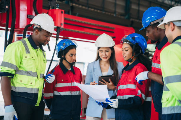 istock Engineers and foreman inspecting and meeting about the automated arms machine welding robots at factory machines. Worker industry working in the manufacture industrial. 1781270506