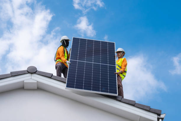 istock Service engineer installing solar cell on the roof of house. Technicians working about solar panel system outdoors. Clean and Renewable energy concept. 1781275869