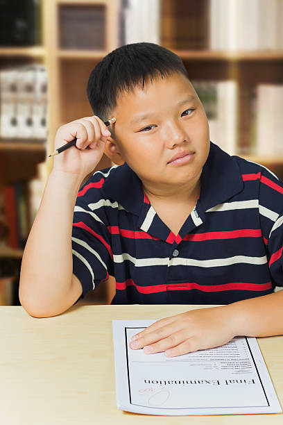 istock Asian boy upset with his exam result 178128777