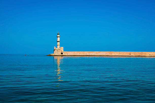 Famous lighthouse in bay of Chania stock photo