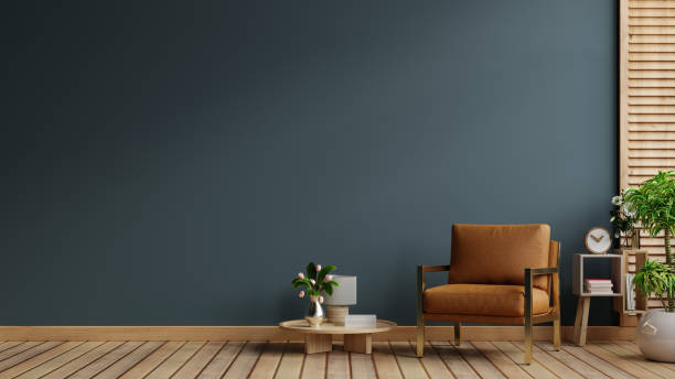 interno del soggiorno blu scuro con accogliente poltrona in pelle - armchair sofa leather brown foto e immagini stock