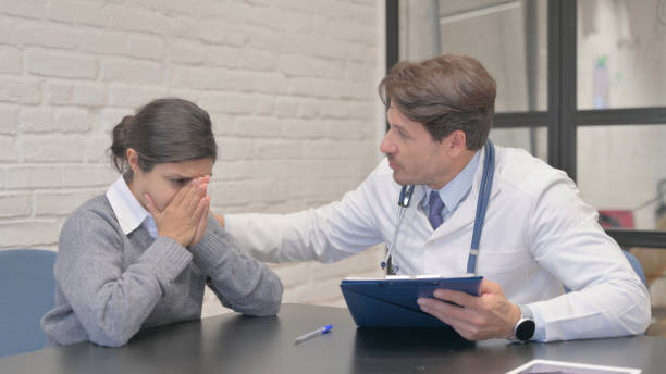 istock Doctor Helping Crying Indian Woman, Sharing Medical Reports 1781299201