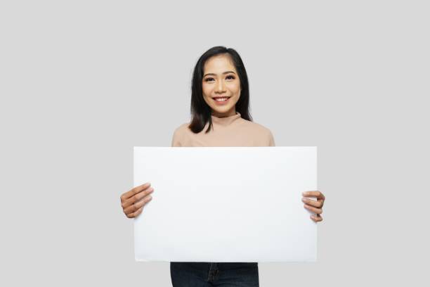 istock Beautiful Girl Holding a Sign 1781303057