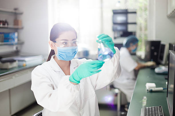 scientists working at the laboratory. scientists working at the laboratory. beaker stock pictures, royalty-free photos & images