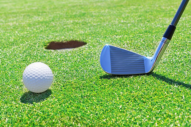 istock Golf stick  ball near the hole. 178133203