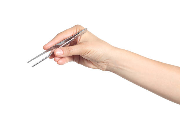 istock Woman hand using a tweezers 178134023