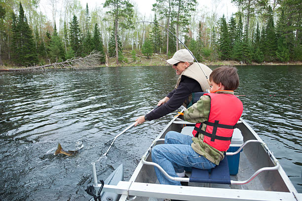 istock Young boy fisherman catches a walleye 178134389