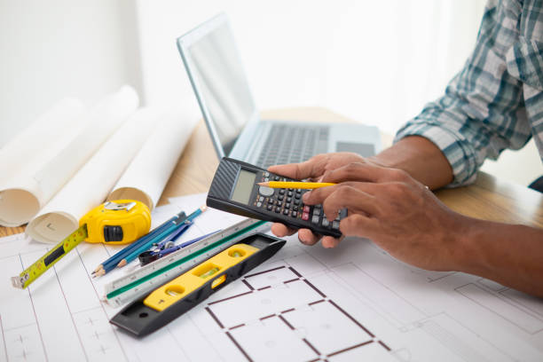 istock Construction engineers are checking blueprints and calculating their accuracy after receiving plans from architect in order start  construction safely. Inspection Concept from construction engineering 1781354245