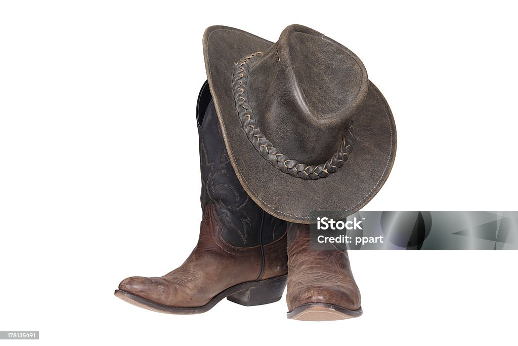 Des bottes de cow-boy et bonnet - Photo de Santiags libre de droits