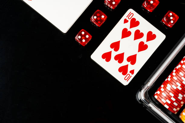 istock Playing cards and poker chips on black background 1781362314