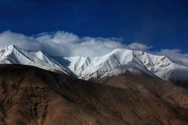 istock Scenic view of a snow-capped mountain range 1781364784
