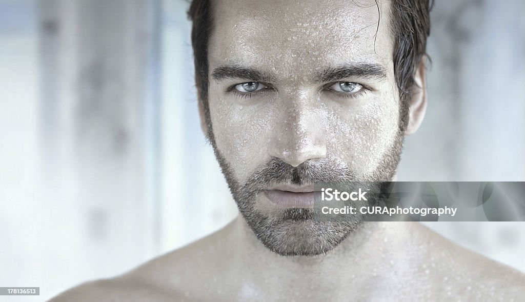 Beautiful man Highly detailed portrait of good looking man with wet face Bathroom Stock Photo