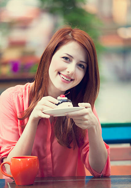 istock Style redhead girl with cake and cup 178136740