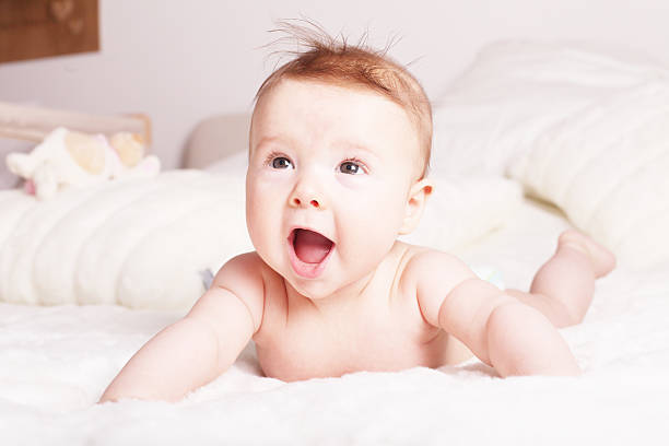 istock Baby laughing looking up mouth open 178137447