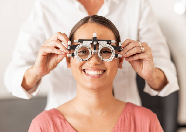 istock Eye test, vision and optometry with a woman customer testing her eyes during an optician appointment. Insurance, consulting and glasses with a female patient in an exam for prescription lenses 1781386121