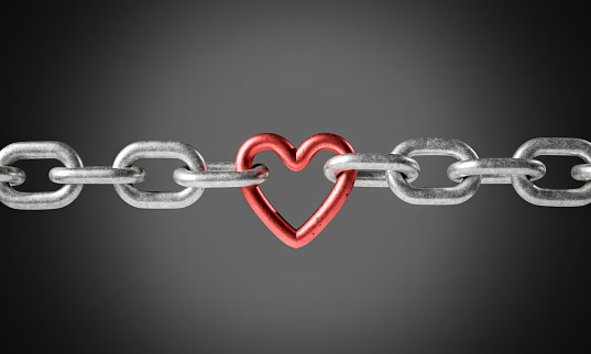 A single red heart-shaped link connects two silver chains against a grey gradient background, symbolizing unbreakable bonds and love. 3D rendering