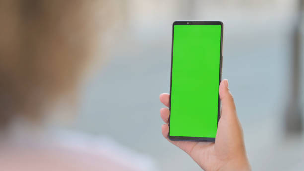 istock Outdoor Young African Woman Using Phone with Green Screen 1781394677