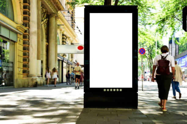 istock blank billboard, lightbox ad along sidewalk. outdoor advertising sign panel mockup. European streetscape 1781396235