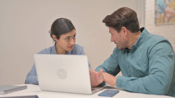 istock Close up of Multi Ethnic People Working on Laptop 1781404420