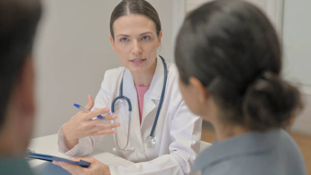 istock Doctor Talking with Mixed Race Couple 1781415615