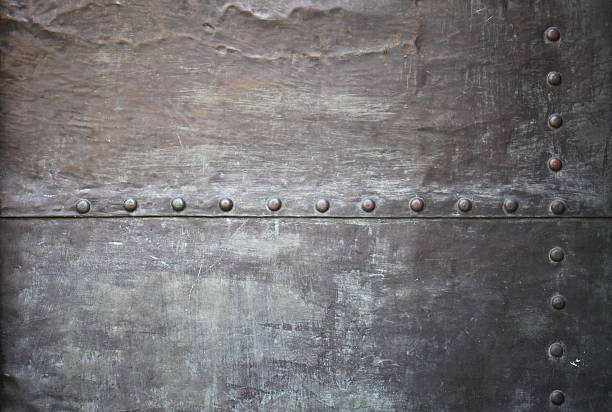 istock Black metal plate or armour texture with rivets 178142402