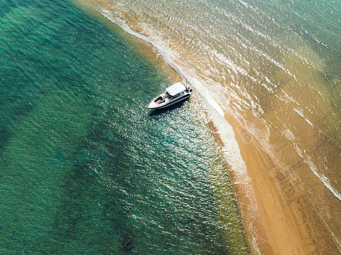 Aerial view of Speed boat in the aqua sea, Drone view.