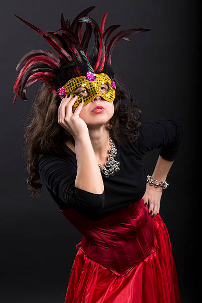 istock Young romany woman posing on carnaval with mask 178143936