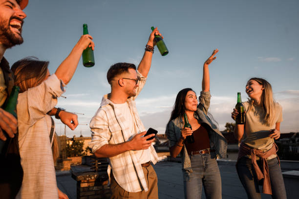 istock Young cheerful friends having fun on a rooftop. 1781444635