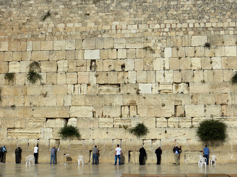 Jerusalem, Israel - May 15, 2015: Israeli Jewish men praying at the Western Wall in Jerusalem