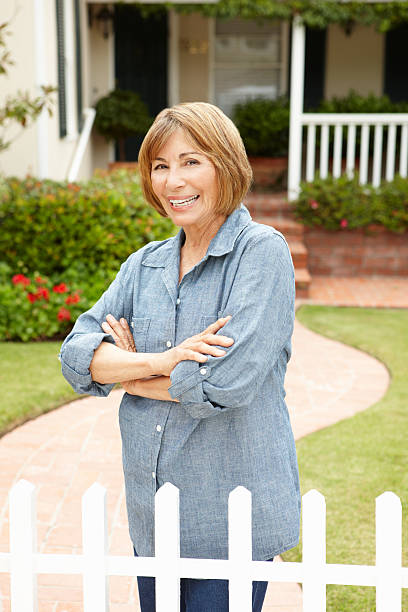 istock Senior Hispanic woman outside home 178145019
