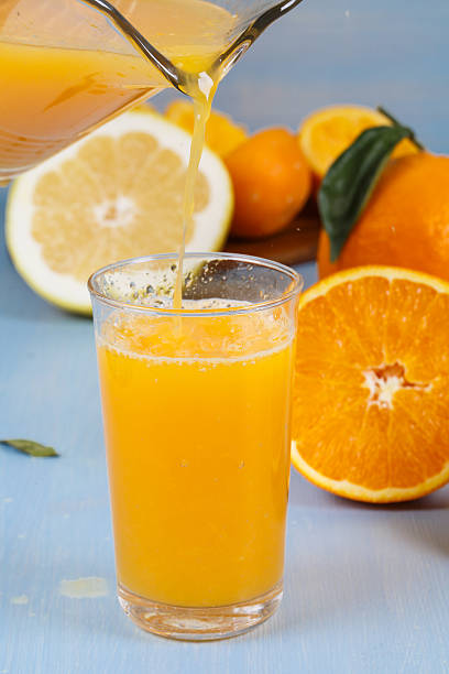 istock Orange juice is poured into a glass 178145441