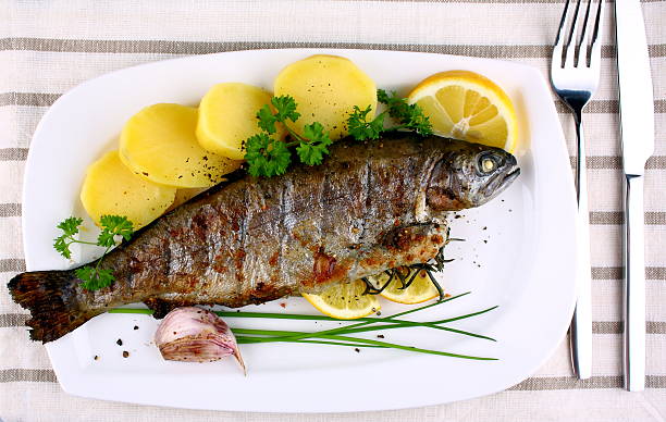istock Grilled whole trout with potato, lemon and garlic 178145887