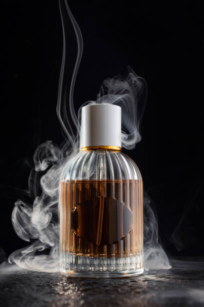 istock Glass bottle of perfume with a smoke 1781464528