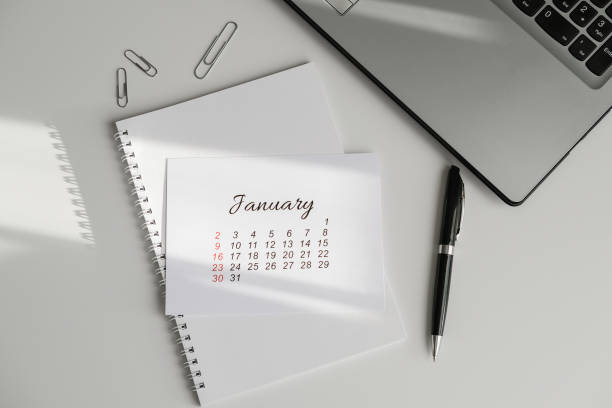 istock January calendar, notepad and laptop on the office table 1781467250