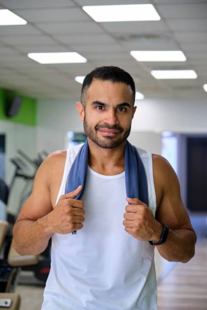 Portrait of a strong Latin man at a gym looking at camera. stock photo