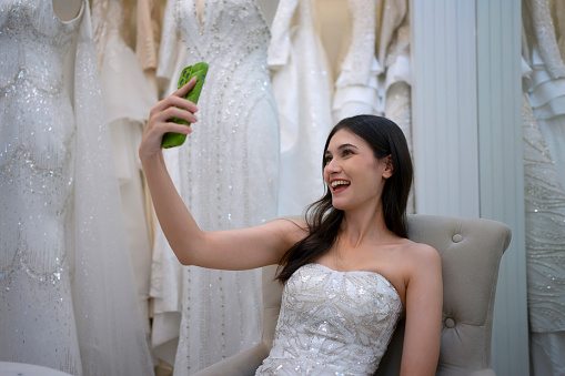 The bride selfie at wedding studio. Lifestyle and wedding concept.