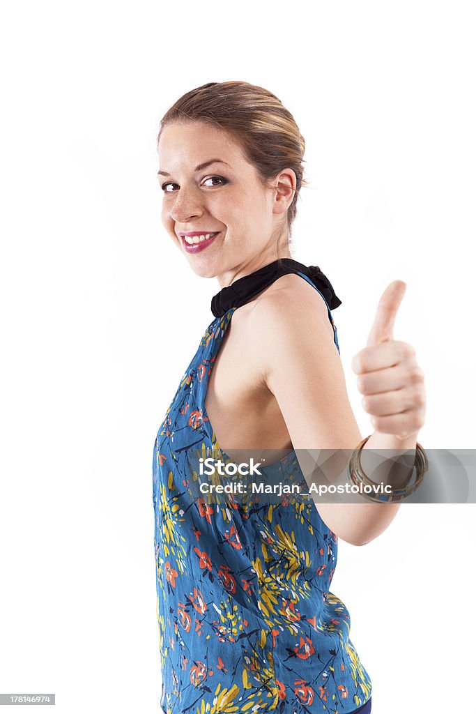 Young woman showing thumbs up Young woman showing thumbs up, isolated on white. 20-29 Years Stock Photo