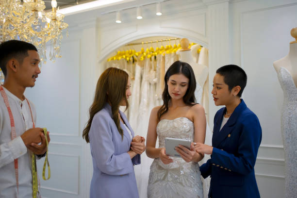 istock Couple choose dress at wedding studio. 1781470990