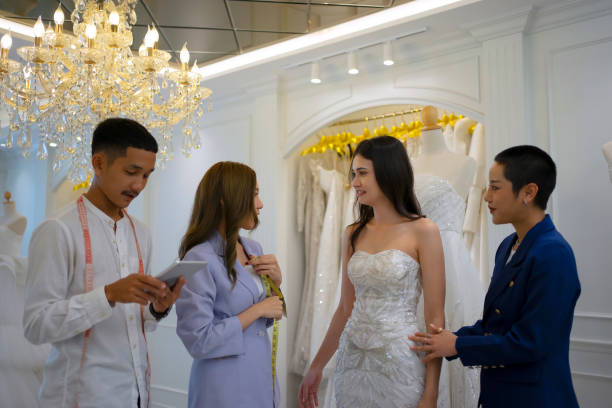 istock Couple choose dress at wedding studio. 1781470995